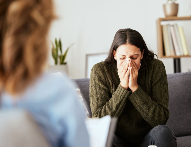person feeling overwhelmed during trauma therapy