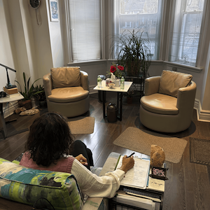 therapist seated in Rafati counselling office prepared for trauma therapy session